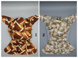 SassyCloth one size pocket cloth diaper with football and baseball cotton print.