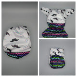 SassyCloth one size pocket cloth diaper with mustache PUL print.