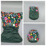 Cloth diaper SassyCloth one size pocket diaper with mushrooms and flowers cotton print.