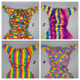 Cloth diaper SassyCloth one size pocket diaper with rainbow and puzzle print.