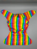 Cloth diaper SassyCloth one size pocket diaper with rainbow and puzzle print.