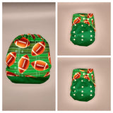SassyCloth one size pocket cloth diaper with football cotton print.