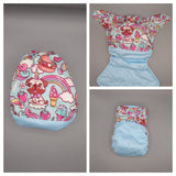 Cloth diaper SassyCloth one size pocket diaper with unicorn puppy cotton print.