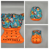 SassyCloth one size pocket cloth diaper with gnomes and turkeys cotton print.