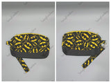 Clematis wristlet clutch with various prints and removable strap.