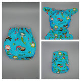 SassyCloth one size pocket cloth diaper with mermaids cotton print.