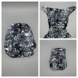 SassyCloth one size pocket cloth diaper with sculls cotton print.